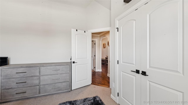 14934 S Sequoia St, Glenpool, OK 74033 - unfurnished bedroom featuring carpet flooring, arched walkways, and a closet