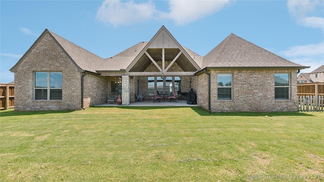 14934 S Sequoia St, Glenpool, OK 74033 - back of property with brick siding, a patio area, and roof with shingles