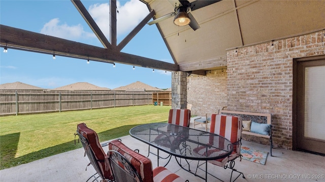 14934 S Sequoia St, Glenpool, OK 74033 - fenced backyard featuring a patio area, a ceiling fan, and outdoor dining area