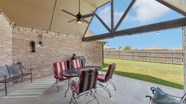 14934 S Sequoia St, Glenpool, OK 74033 - fenced backyard with a ceiling fan, a patio area, and outdoor dining space