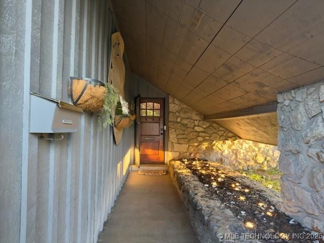 104 E 58th St, Tulsa, OK 74105 - view of exterior entry featuring stone siding