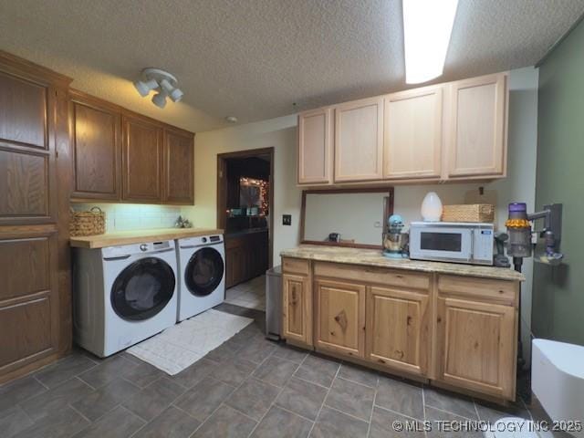 104 E 58th St, Tulsa, OK 74105 - washroom with independent washer and dryer and a textured ceiling