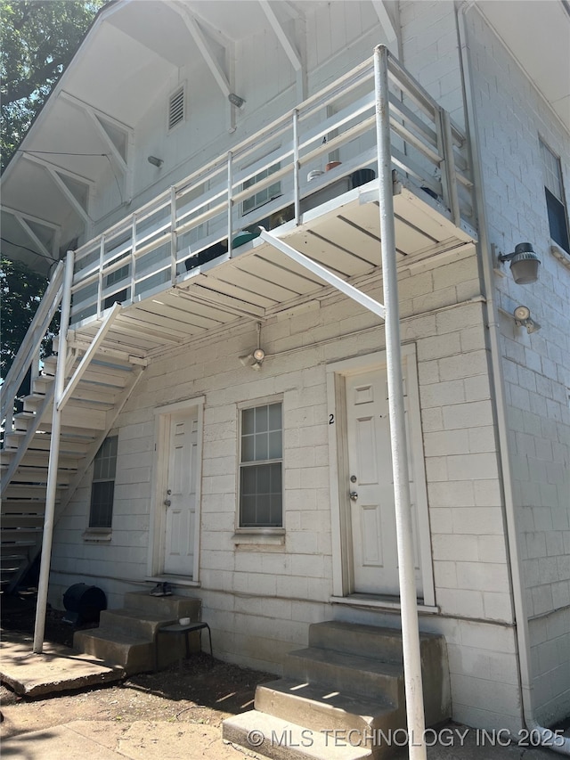 1215 S Quincy Ave, Tulsa, OK 74120 - view of exterior entry featuring concrete block siding