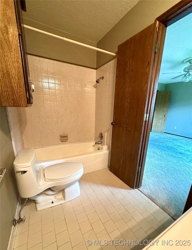 204 E 24th Ct, Owasso, OK 74055 - bathroom featuring tile patterned floors, shower / bathtub combination, ceiling fan, and a textured ceiling