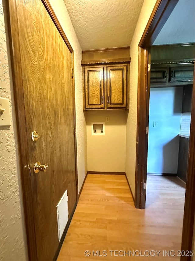 204 E 24th Ct, Owasso, OK 74055 - hallway with a textured ceiling, light wood-style floors, and a textured wall