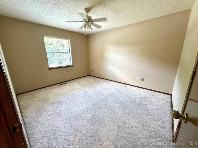 204 E 24th Ct, Owasso, OK 74055 - carpeted spare room with ceiling fan, a textured ceiling, and a textured wall