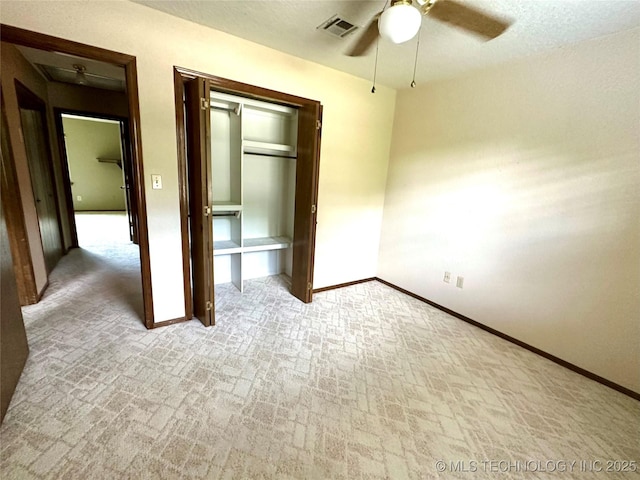 204 E 24th Ct, Owasso, OK 74055 - unfurnished bedroom with brick patterned flooring, a closet, and ceiling fan