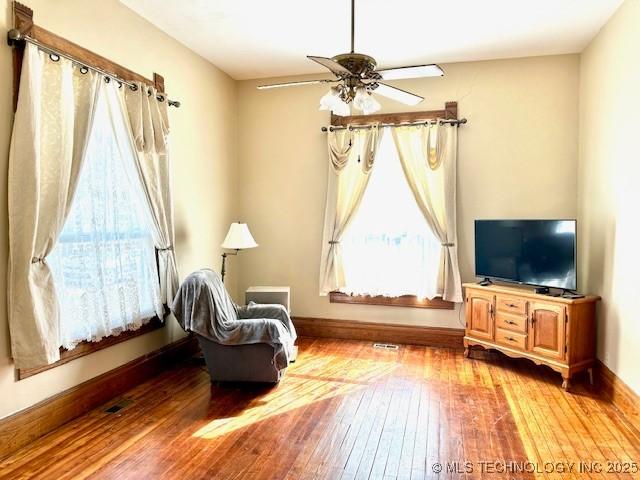 349 S Foreman St, Vinita, OK 74301 - living area with a ceiling fan and wood-type flooring