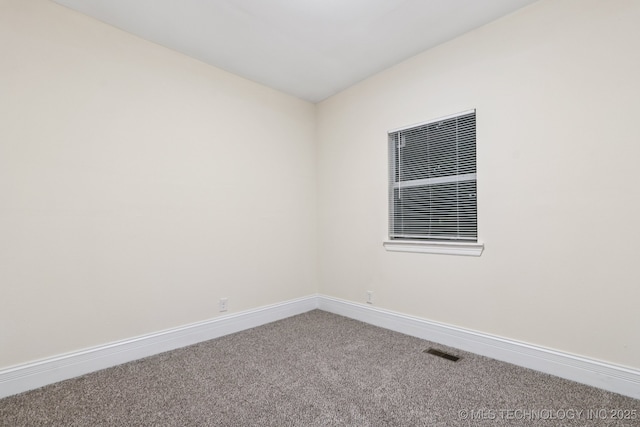 224 E Oklahoma St, Tulsa, OK 74106 - carpeted empty room featuring baseboards