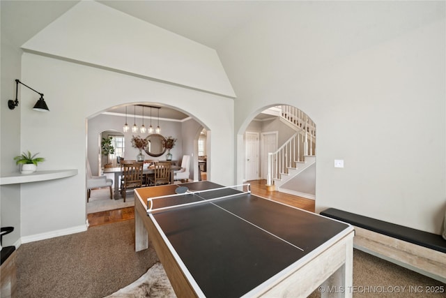 5117 E 92nd St, Tulsa, OK 74137 - rec room featuring arched walkways, dark carpet, and a high ceiling