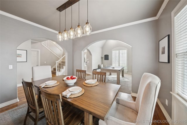 5117 E 92nd St, Tulsa, OK 74137 - dining space with arched walkways, stairway, wood finished floors, and crown molding