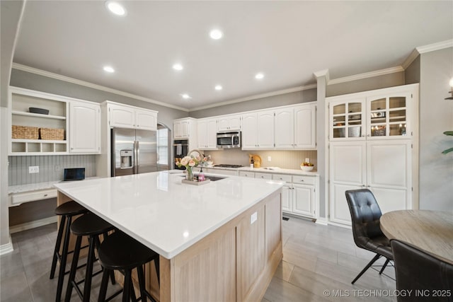5117 E 92nd St, Tulsa, OK 74137 - kitchen with stainless steel appliances, open shelves, white cabinetry, a kitchen breakfast bar, and light countertops