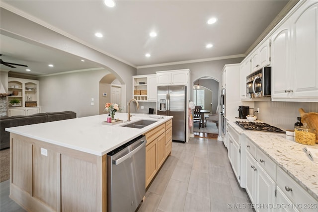 5117 E 92nd St, Tulsa, OK 74137 - kitchen featuring appliances with stainless steel finishes, arched walkways, ornamental molding, recessed lighting, and backsplash