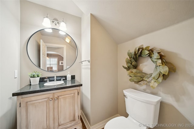 5117 E 92nd St, Tulsa, OK 74137 - bathroom featuring vanity and vaulted ceiling