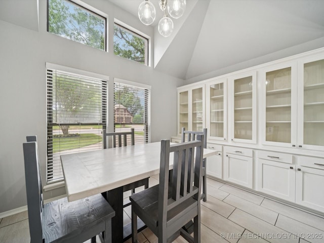 5607 E 76th St, Tulsa, OK 74136 - dining space with a chandelier and high vaulted ceiling
