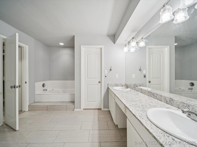 5607 E 76th St, Tulsa, OK 74136 - full bathroom featuring a garden tub, double vanity, tile patterned floors, and recessed lighting