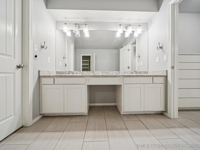 5607 E 76th St, Tulsa, OK 74136 - bathroom with double vanity and wood tiled floors