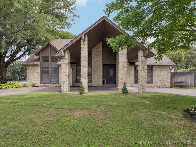 5607 E 76th St, Tulsa, OK 74136 - mid-century home with stone siding and a shingled roof