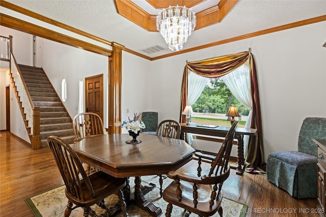 501 W 35th Pl, Sand Springs, OK 74063 - dining area featuring ornate columns, wood finished floors, a chandelier, stairs, and crown molding