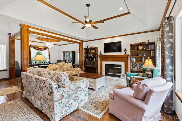 501 W 35th Pl, Sand Springs, OK 74063 - living area featuring a tray ceiling, a ceiling fan, a glass covered fireplace, wood finished floors, and ornamental molding