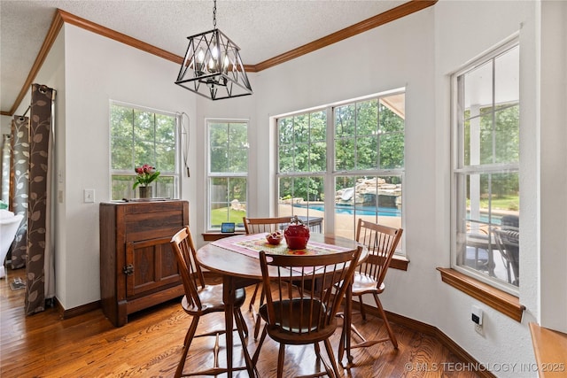 501 W 35th Pl, Sand Springs, OK 74063 - dining area with ornamental molding, a chandelier, light wood-style flooring, and a textured ceiling