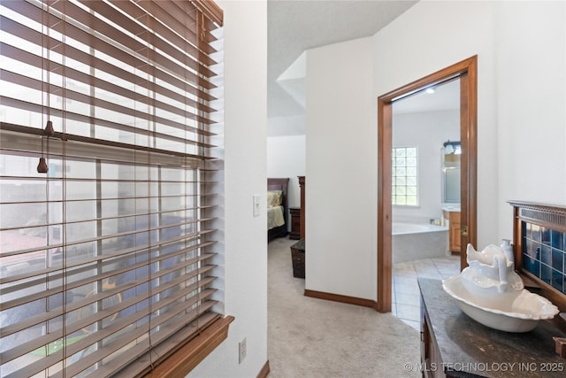 501 W 35th Pl, Sand Springs, OK 74063 - corridor with light carpet and baseboards