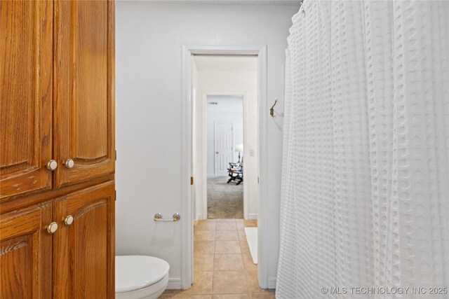 501 W 35th Pl, Sand Springs, OK 74063 - bathroom featuring tile patterned floors and a shower with shower curtain