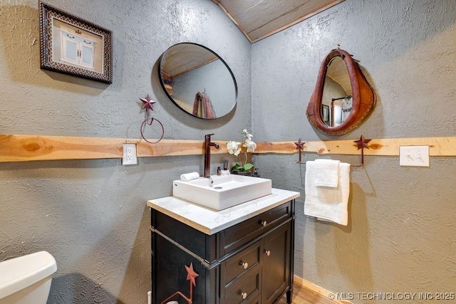 62141 E 313th Rd Unit 3, Grove, OK 74344 - bathroom with vanity and a textured wall