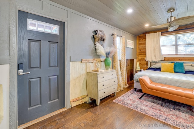 62141 E 313th Rd Unit 3, Grove, OK 74344 - bedroom with wooden walls, wood-type flooring, recessed lighting, wainscoting, and wood ceiling