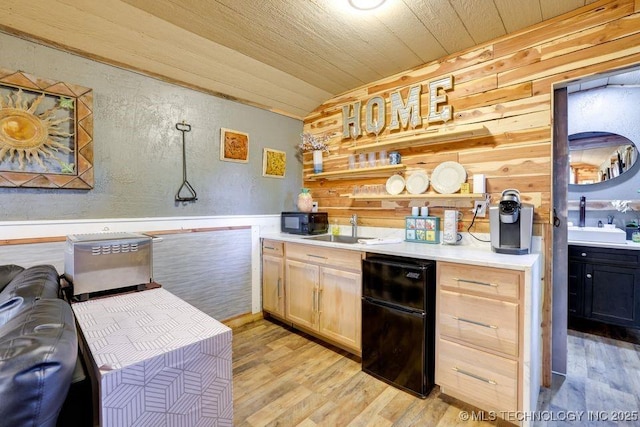 62141 E 313th Rd Unit 3, Grove, OK 74344 - kitchen with refrigerator, wooden walls, vaulted ceiling, light wood-type flooring, and a textured wall
