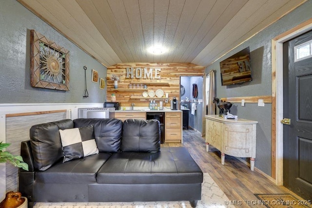 62141 E 313th Rd Unit 3, Grove, OK 74344 - living area featuring bar, wood finished floors, wooden ceiling, vaulted ceiling, and a textured wall