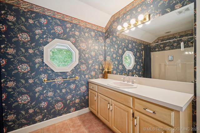 3431 E 96th Pl, Tulsa, OK 74137 - full bath with lofted ceiling, vanity, tile patterned flooring, and a shower with shower curtain