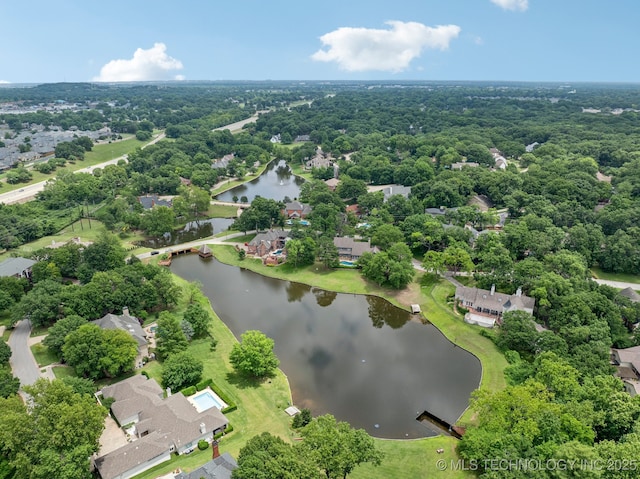 3431 E 96th Pl, Tulsa, OK 74137 - aerial perspective of suburban area with a nearby body of water and a forest