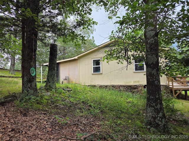 92133 S 4676th Rd, Bunch, OK 74931 - view of side of home featuring a wooden deck