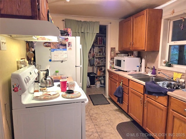 92133 S 4676th Rd, Bunch, OK 74931 - kitchen with white appliances, washer / dryer, range hood, brown cabinets, and ornamental molding