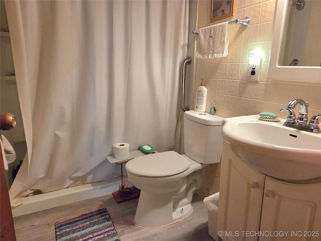 92133 S 4676th Rd, Bunch, OK 74931 - full bathroom featuring wood finished floors, decorative backsplash, vanity, a shower with curtain, and tile walls