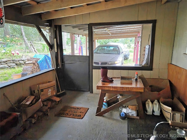 92133 S 4676th Rd, Bunch, OK 74931 - misc room featuring concrete flooring, wooden walls, and plenty of natural light