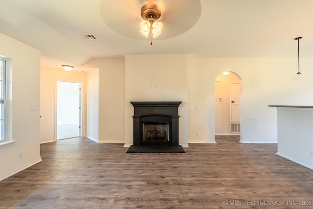 2708 W Fredericksburg St, Broken Arrow, OK 74011 - unfurnished living room with arched walkways, ceiling fan, dark wood finished floors, a fireplace, and lofted ceiling