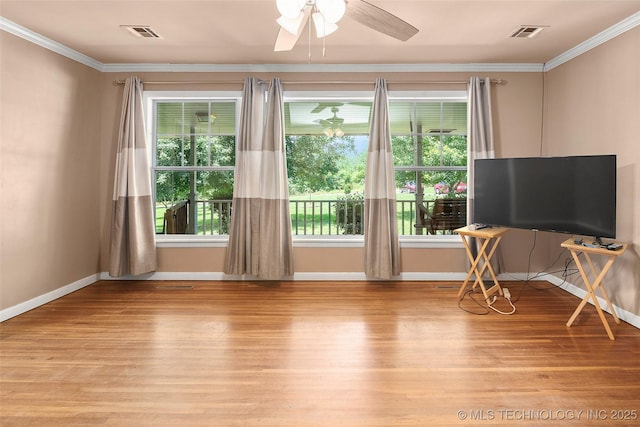 17997 S 4160th Rd W, Claremore, OK 74017 - living area featuring light wood-style flooring, ornamental molding, plenty of natural light, and a ceiling fan
