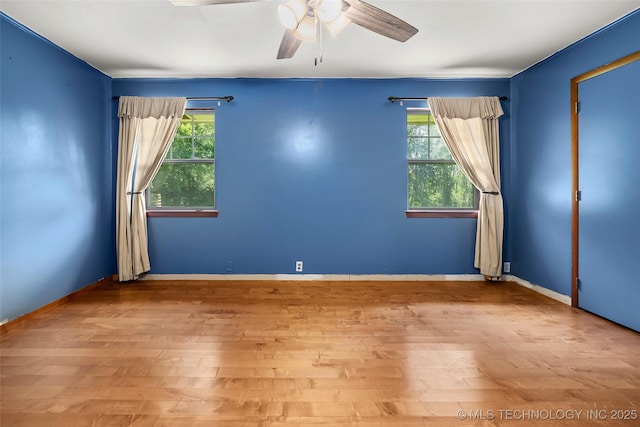 17997 S 4160th Rd W, Claremore, OK 74017 - unfurnished room featuring plenty of natural light, wood finished floors, and a ceiling fan