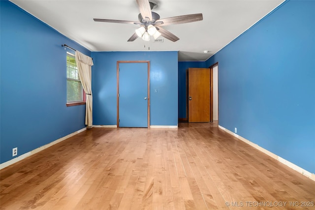 17997 S 4160th Rd W, Claremore, OK 74017 - unfurnished bedroom featuring wood finished floors, a closet, and a ceiling fan