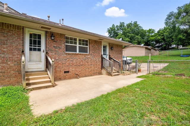 17997 S 4160th Rd W, Claremore, OK 74017 - view of exterior entry featuring brick siding, crawl space, and a patio