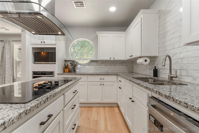 29012 E 63rd St, Broken Arrow, OK 74014 - kitchen featuring stainless steel appliances, island exhaust hood, white cabinetry, decorative backsplash, and recessed lighting