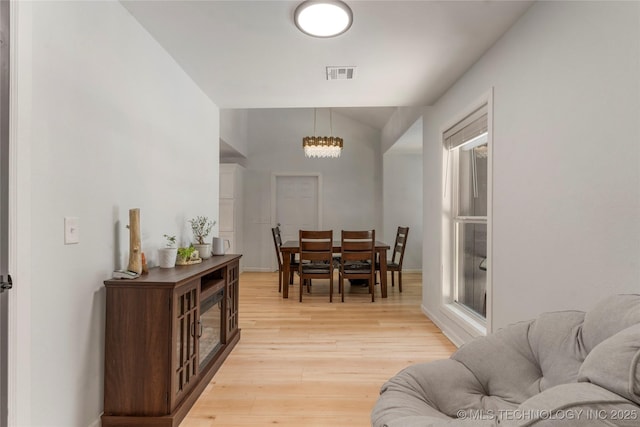 29012 E 63rd St, Broken Arrow, OK 74014 - dining space with light wood-style flooring and a chandelier