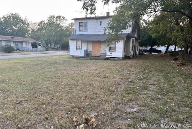 1101 N Collins Ave, Okmulgee, OK 74447 - view of front of house with a front yard