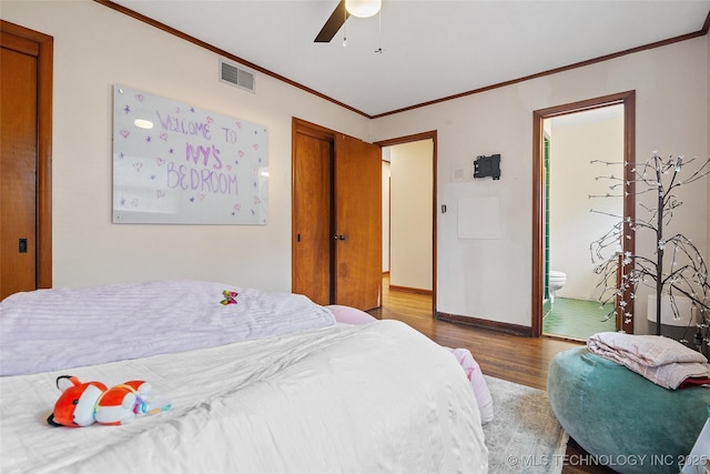 5225 S Toledo Ave, Tulsa, OK 74135 - bedroom featuring wood finished floors, crown molding, ensuite bathroom, a closet, and a ceiling fan