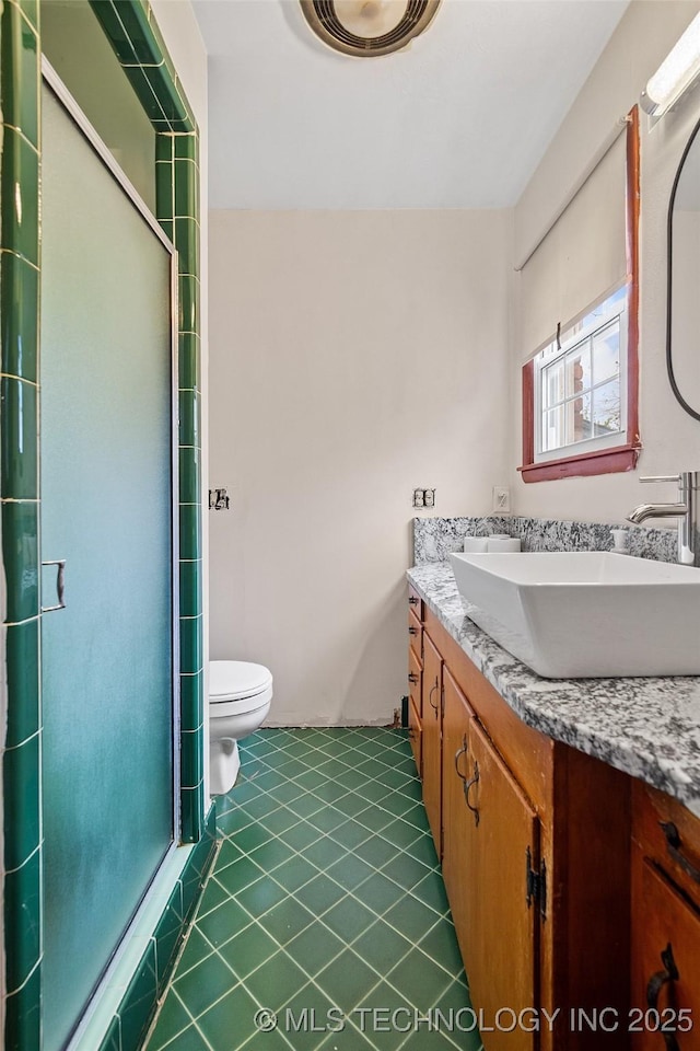 5225 S Toledo Ave, Tulsa, OK 74135 - full bathroom featuring double vanity, a stall shower, and tile patterned flooring