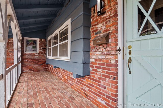 5225 S Toledo Ave, Tulsa, OK 74135 - doorway to property with a porch and brick siding