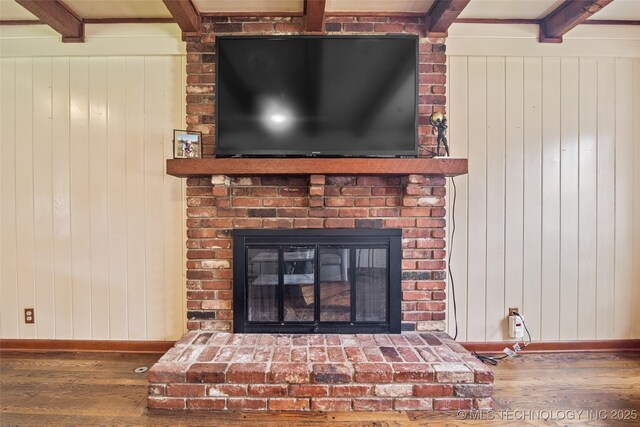 5225 S Toledo Ave, Tulsa, OK 74135 - detailed view of wood finished floors, a brick fireplace, and wood walls