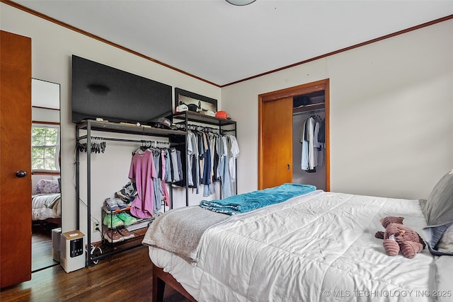 5225 S Toledo Ave, Tulsa, OK 74135 - bedroom featuring crown molding, wood finished floors, and a closet